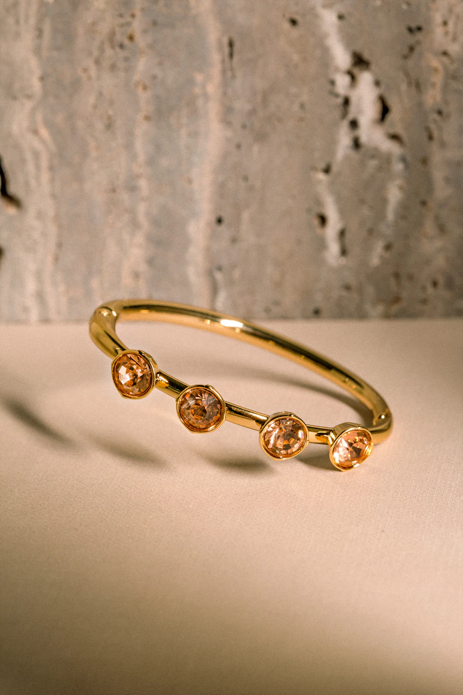 Gold bangle set with three round citrines