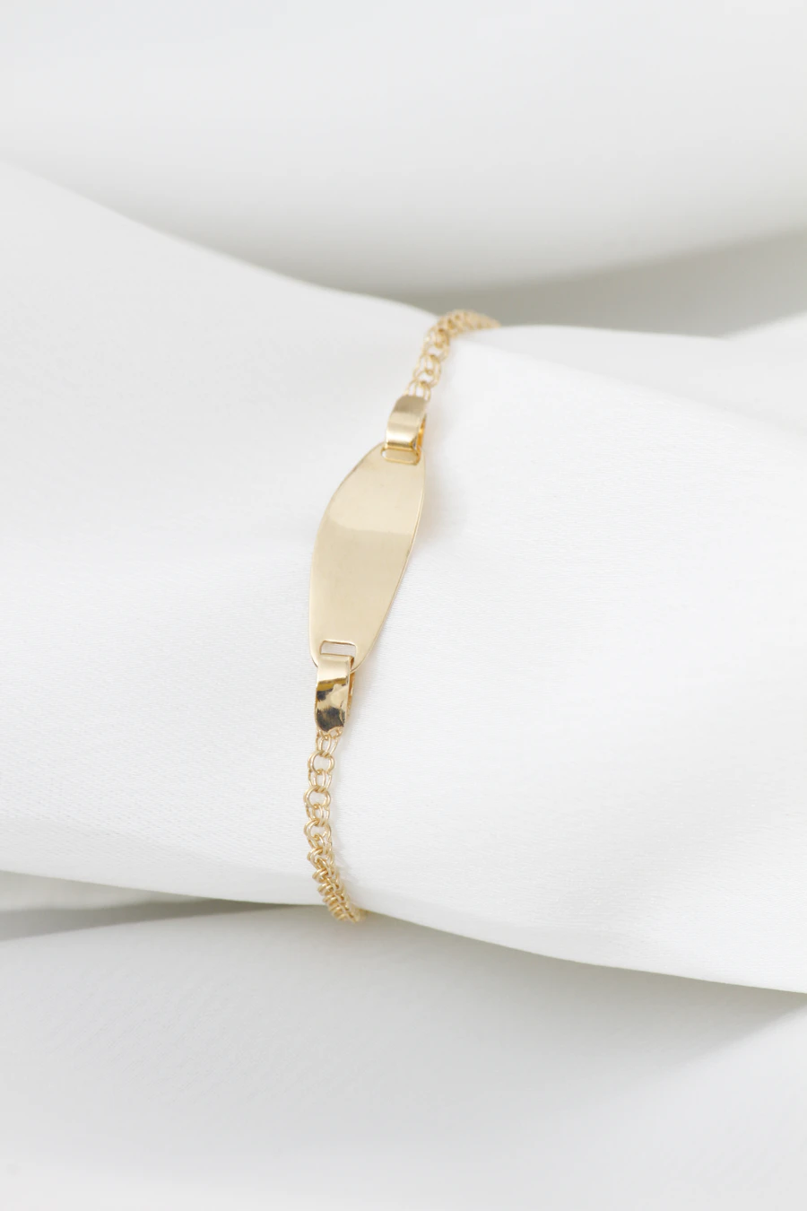Fine gold ID bracelet with a polished bar